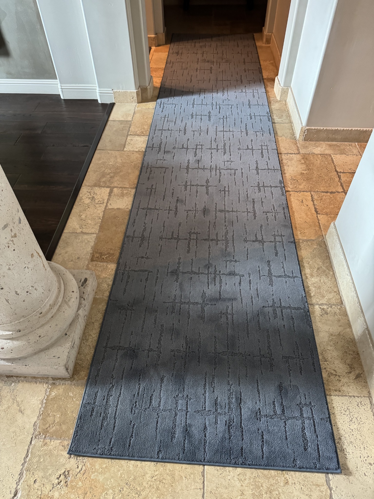 Custom gray hallway runner fitted through an entry corridor