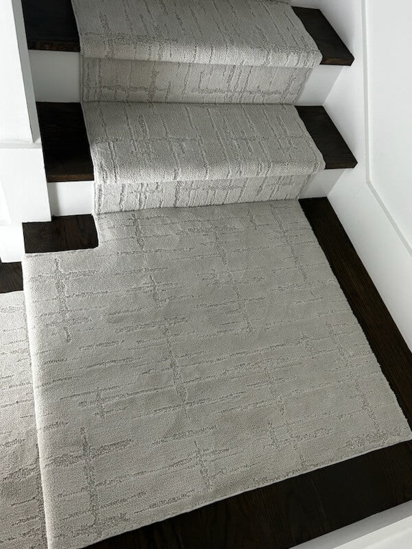 Custom stair runner precisely fitted around a landing