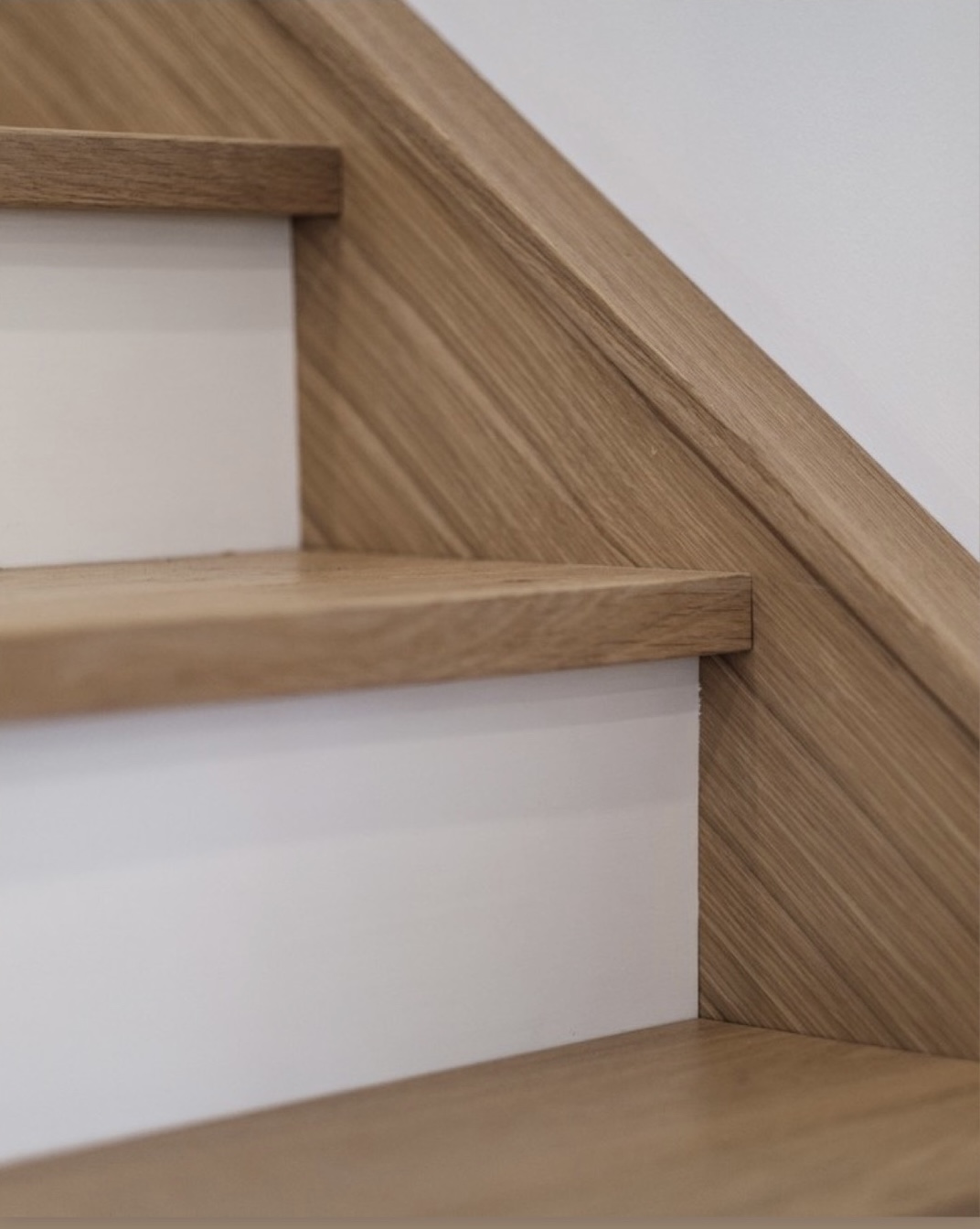 Close-up of precisely hand-cut wood stair tread and side detail