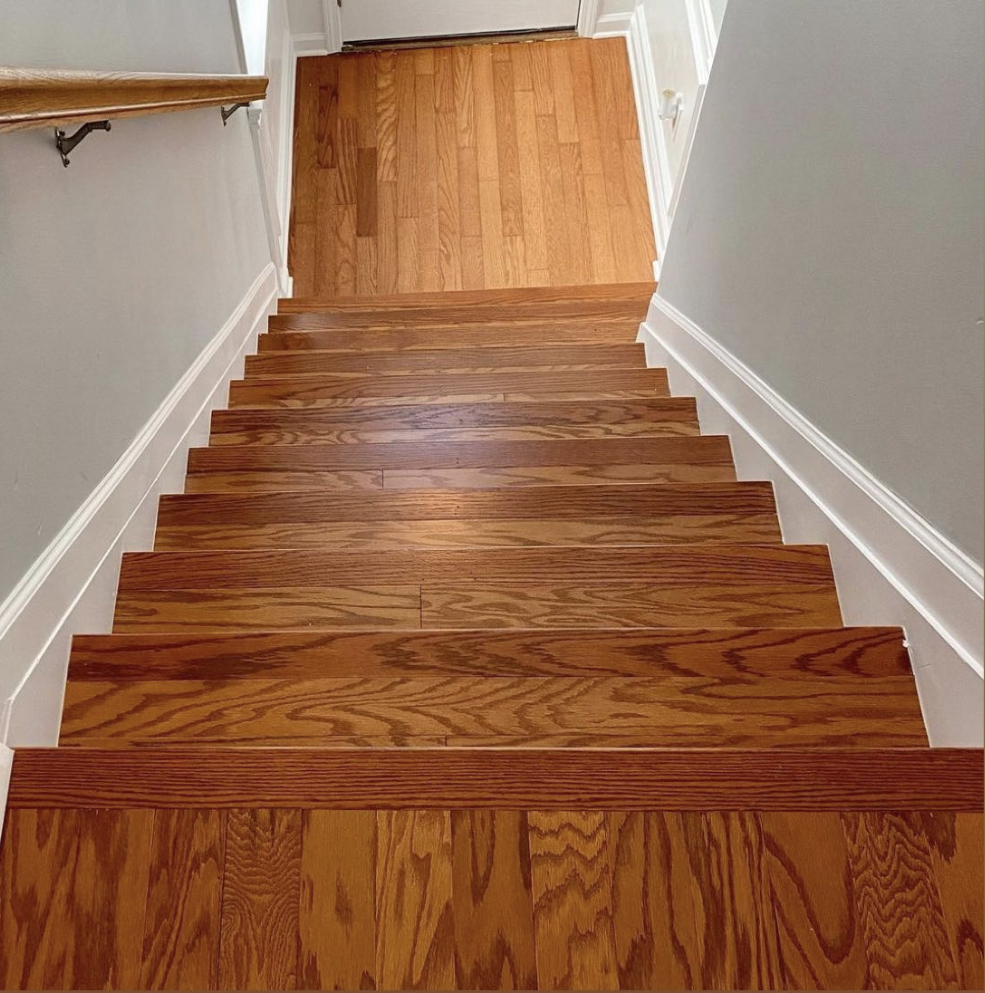 Full flight of custom hardwood stairs with matching landing